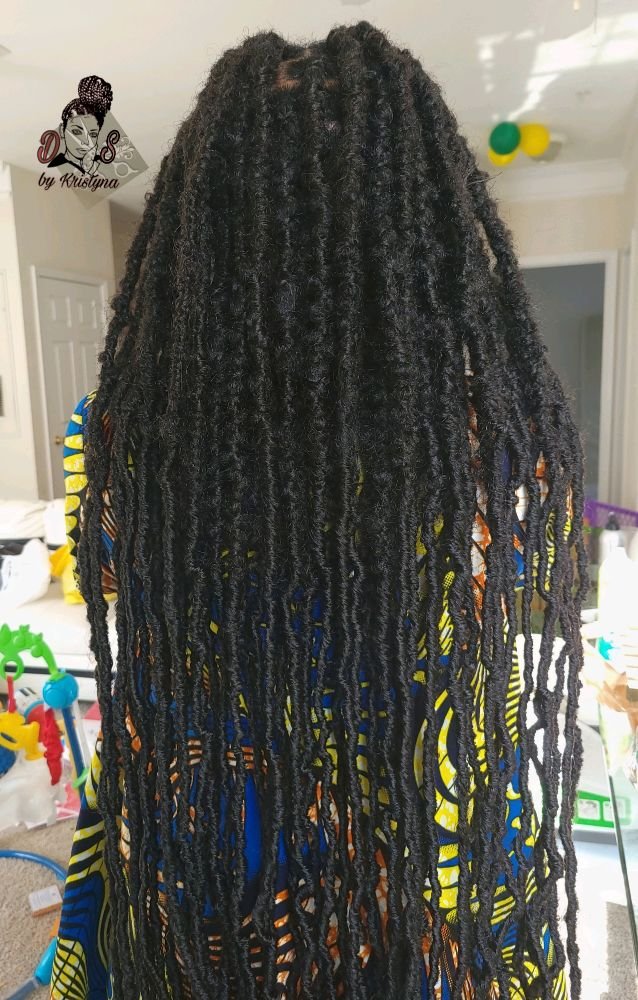 Soft locs in black, extra long and textured, back view