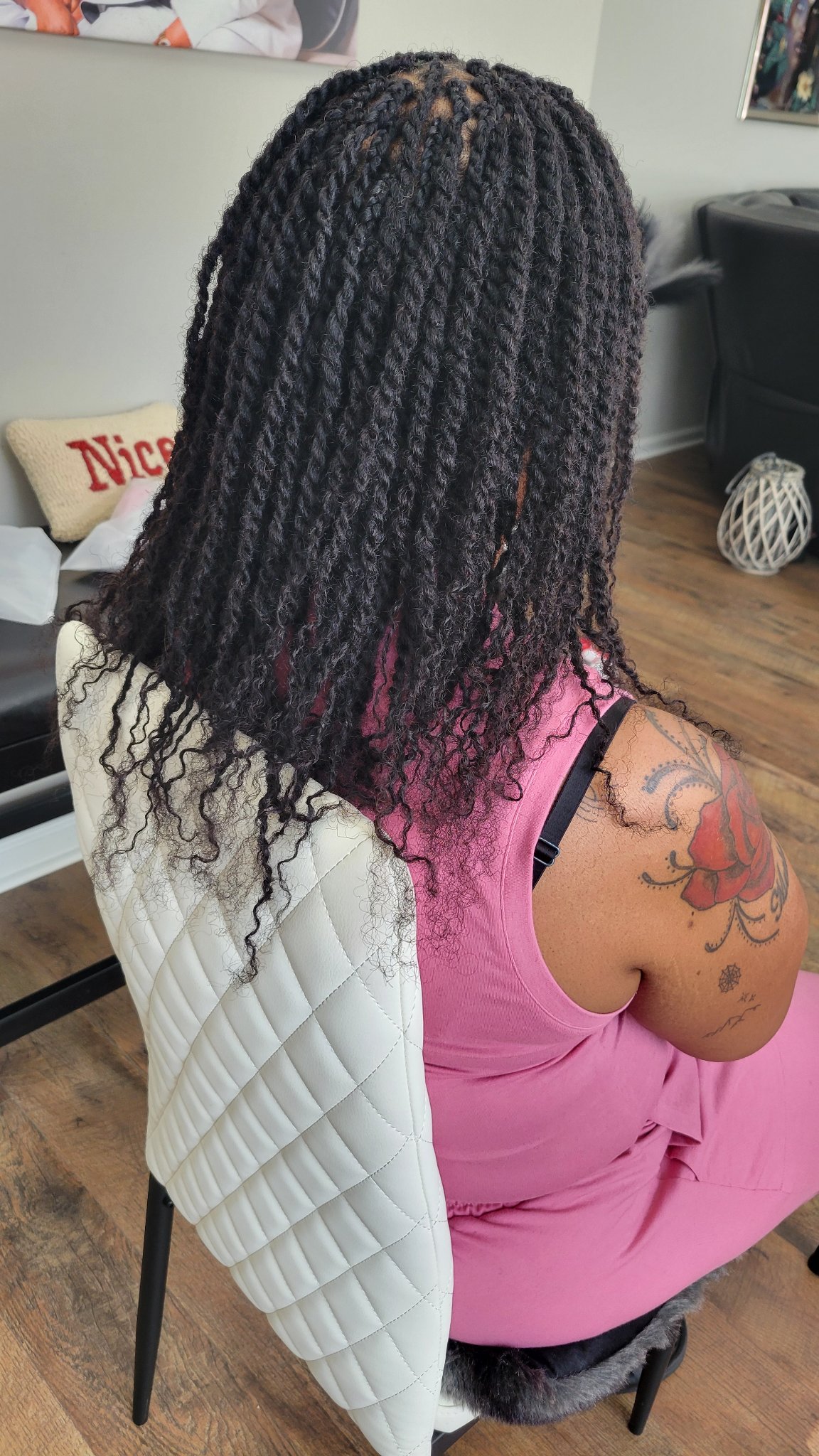Black twists with curly ends, back view