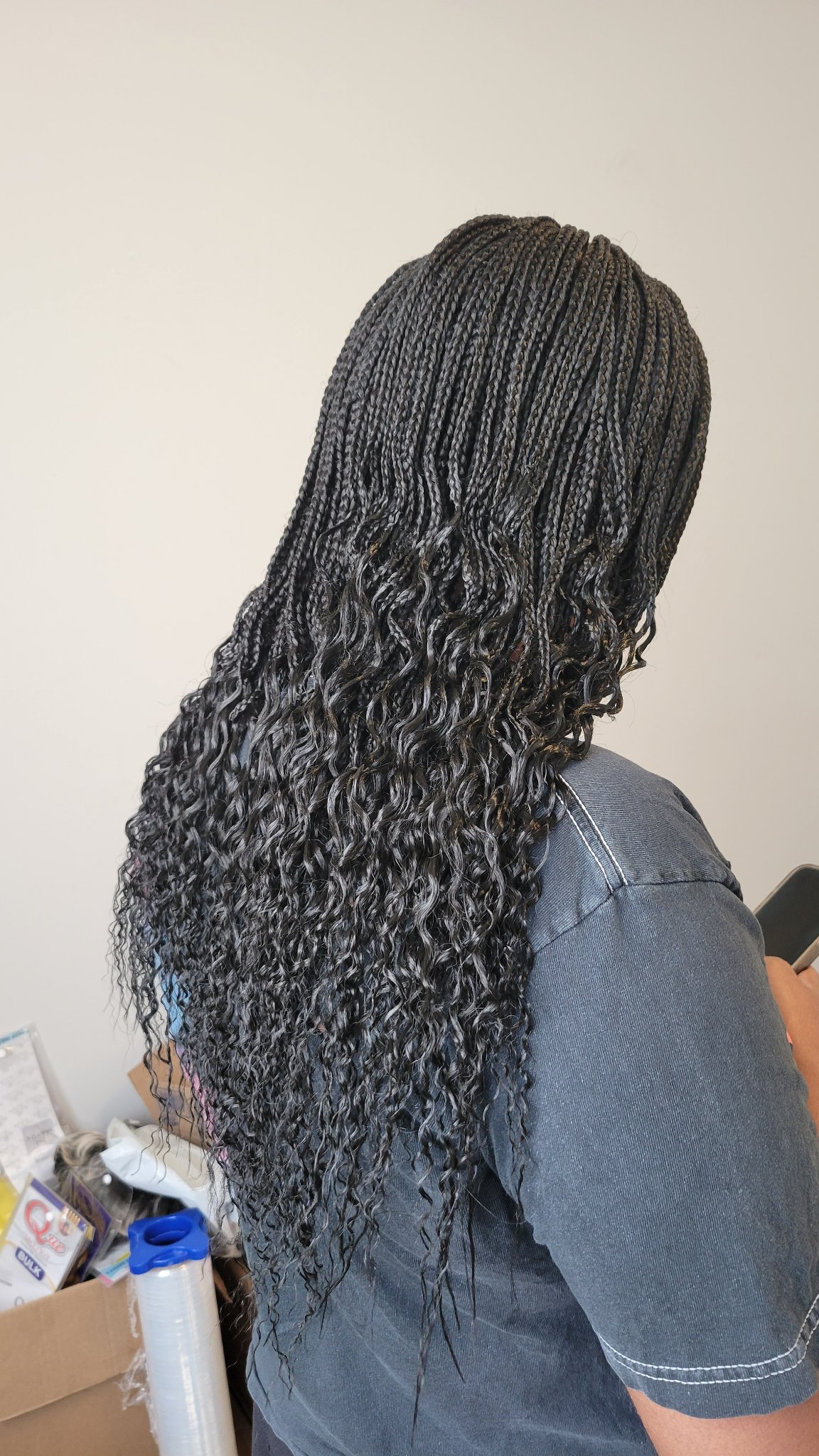 Long black micro braids with curly ends, side and back view