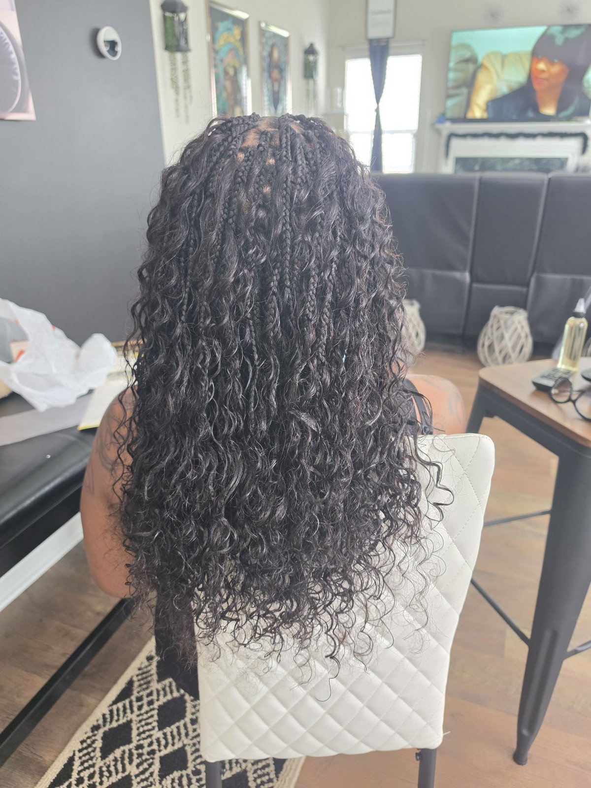 Boho box braids in classic black, color 1B, with long curly ends